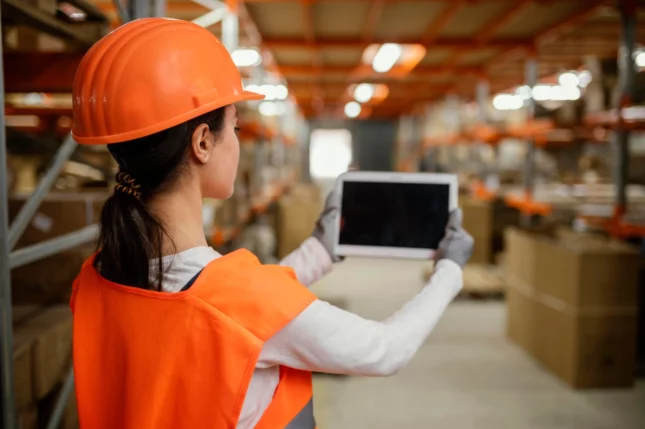 Worker using barcode at the warehouse